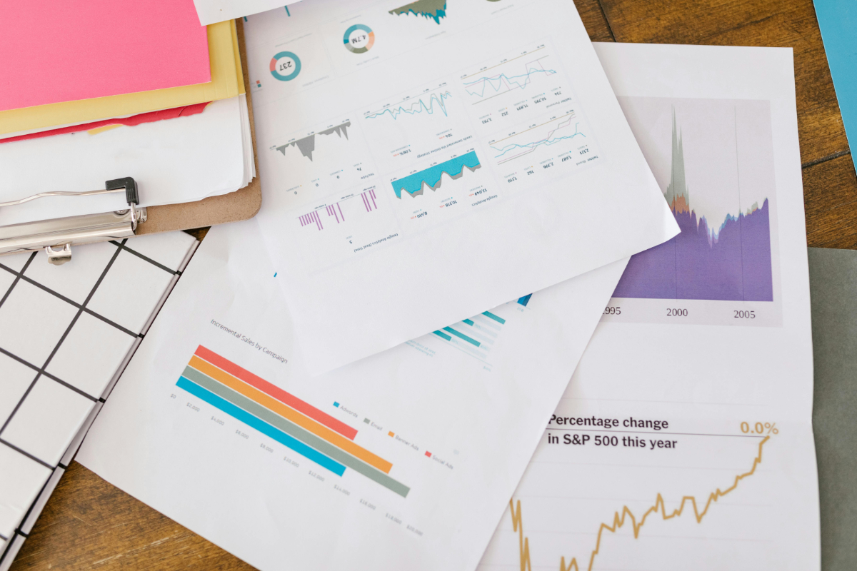 Business documents and charts on desk